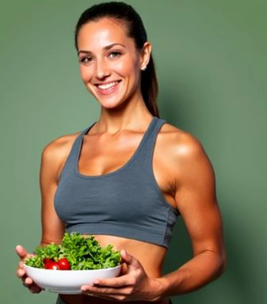Dr. Aseema, dietitian, holding a bowl of fresh salad